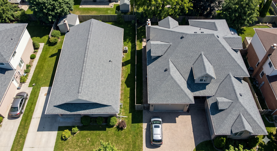 Aerial view comparing two roofs side by side a simple gable roof with one long continuous ridge line, and a complex hip roof with short broken ridge sections, dormers, and valleys